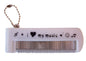 Foldable music print metal tooth comb with glass mirror and ball chain keyring.