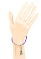 Purple braided leather bracelet with violin charm & lobster claw clasp